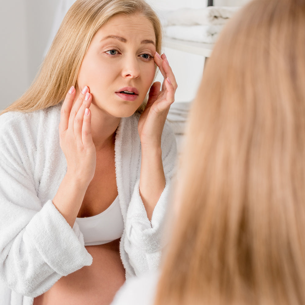 Pregnant woman with hormonal acne receiving gentle skin guidance